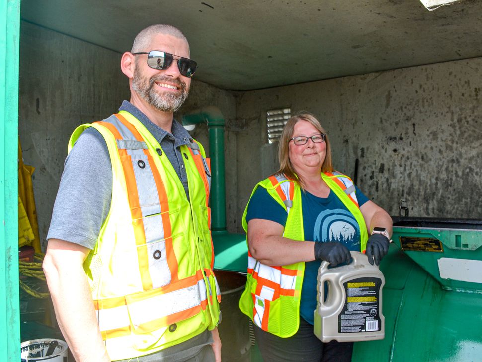 brian and cindy inside the oil recycling building